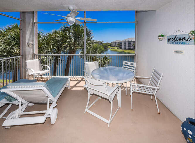 353 Highway 1, Unit F306 Jupiter, FL 33477 - Photo 22 of 43 a dining room with furniture and a floor to ceiling window