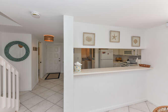 353 Highway 1, Unit F306 Jupiter, FL 33477 - Photo 24 of 43 a view of a bathroom with a sink and a mirror