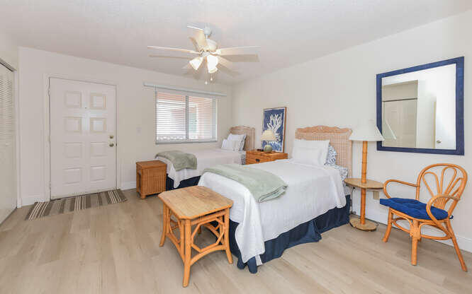 353 Highway 1, Unit F306 Jupiter, FL 33477 - Photo 26 of 43 a bedroom with a bed and wooden floor