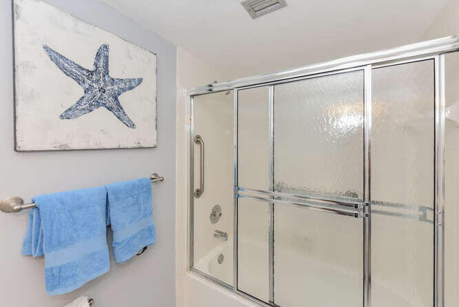 353 Highway 1, Unit F306 Jupiter, FL 33477 - Photo 29 of 43 a bathroom with a glass shower door