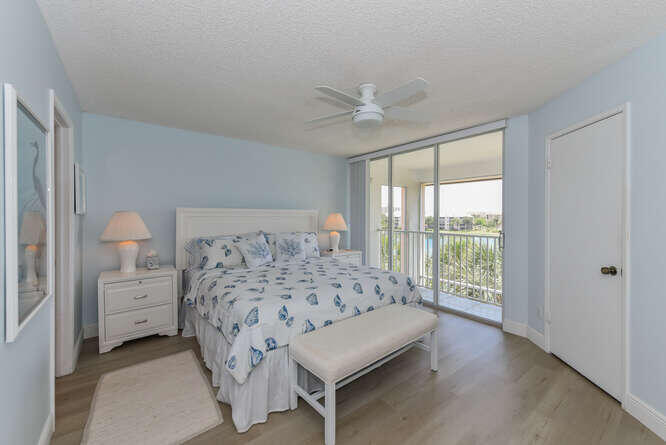 353 Highway 1, Unit F306 Jupiter, FL 33477 - Photo 30 of 43 a bedroom with a bed and a window