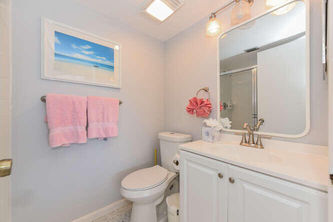 353 Highway 1, Unit F306 Jupiter, FL 33477 - Photo 32 of 43 a bathroom with a sink mirror and toilet