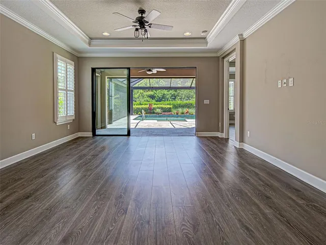 a spacious bathroom with a granite countertop sink a mirror and a vanity