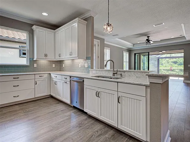 a bathroom with a granite countertop toilet sink and shower