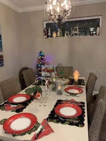 a living room with furniture wooden floor and a large window