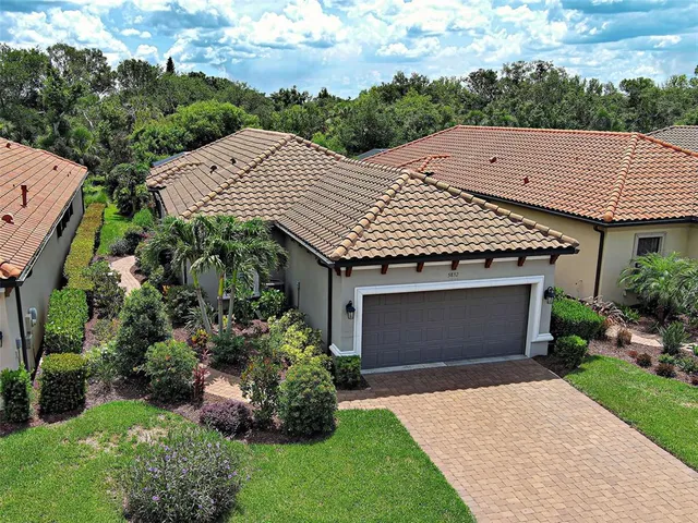 a kitchen with granite countertop white cabinets and stainless steel appliances