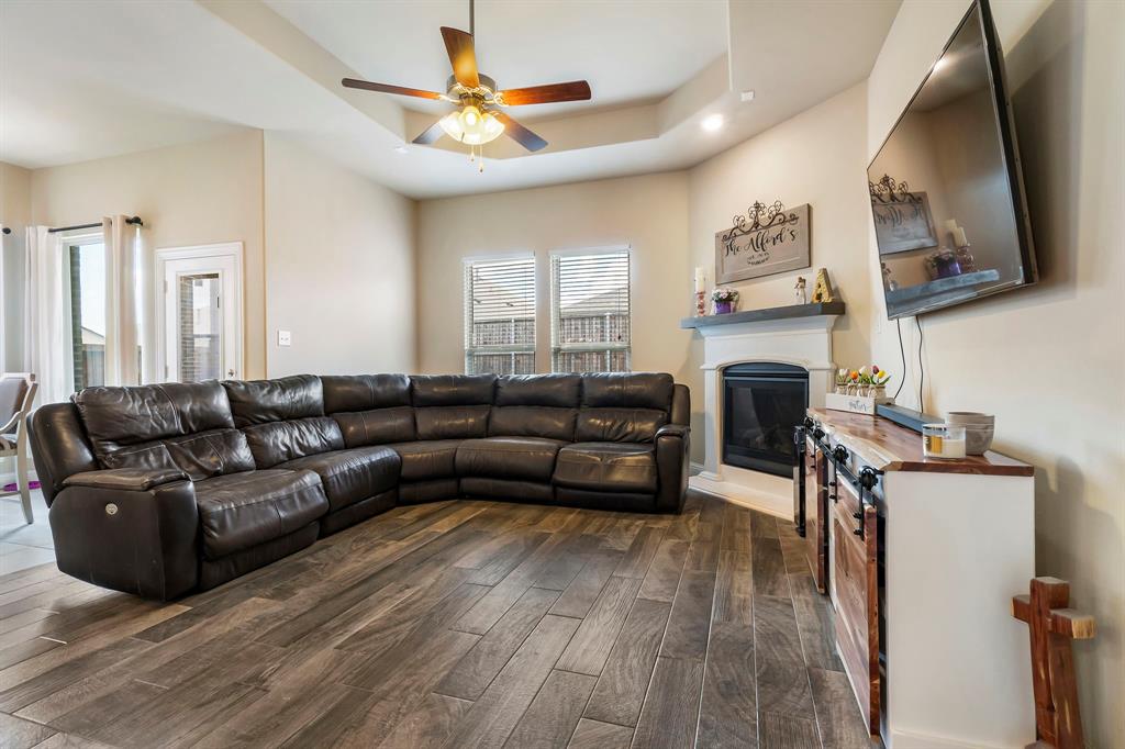3610 Bastrop Street Melissa, TX 75454 - Photo 6 of 23 a living room with furniture and a fireplace