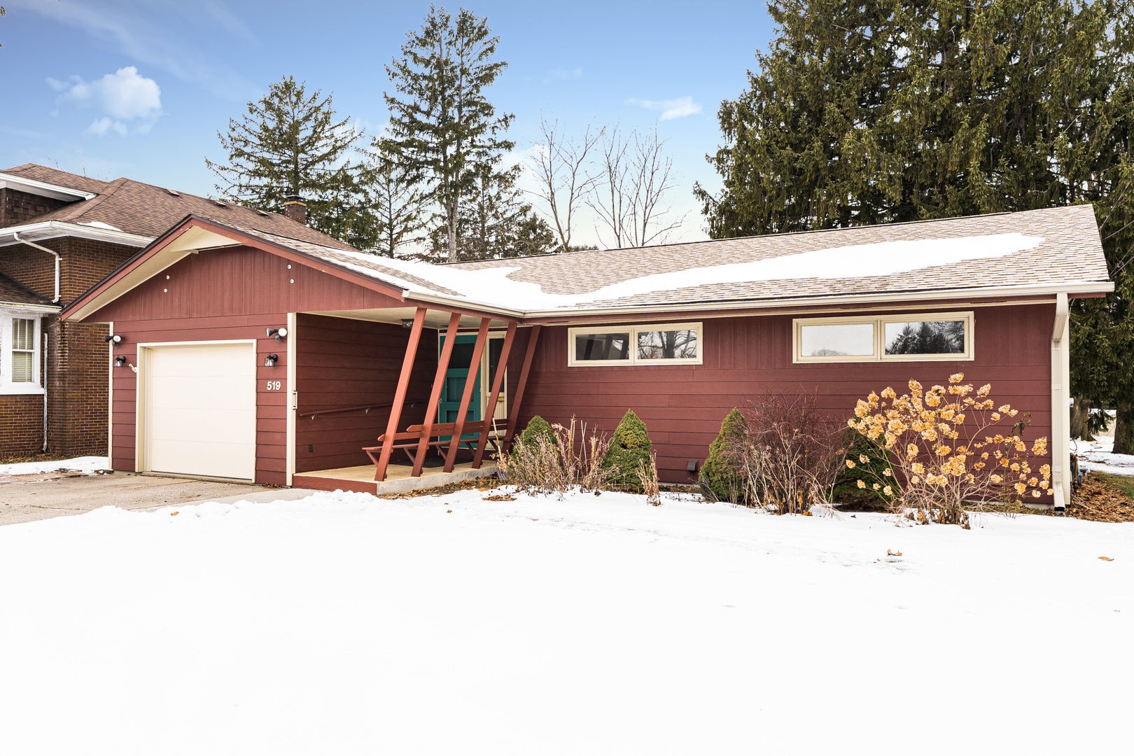 519 Normal Road DeKalb, IL 60115 - Photo 2 of 43 a front view of a house with a yard covered in snow