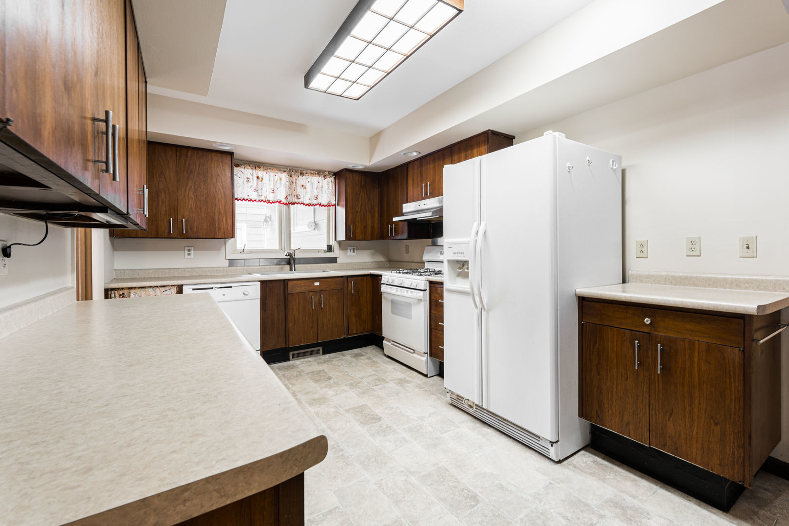 519 Normal Road DeKalb, IL 60115 - Photo 13 of 43 a kitchen with white cabinets and white appliances