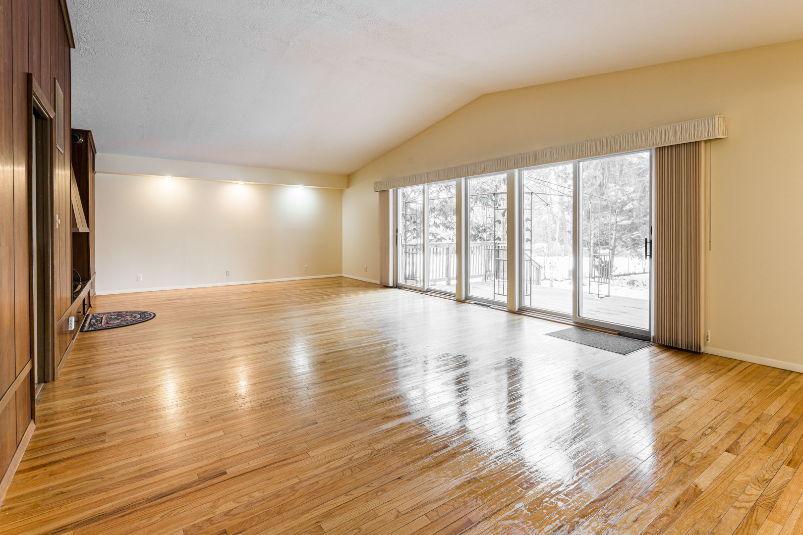 519 Normal Road DeKalb, IL 60115 - Photo 16 of 43 a view of an empty room with wooden floor and a window