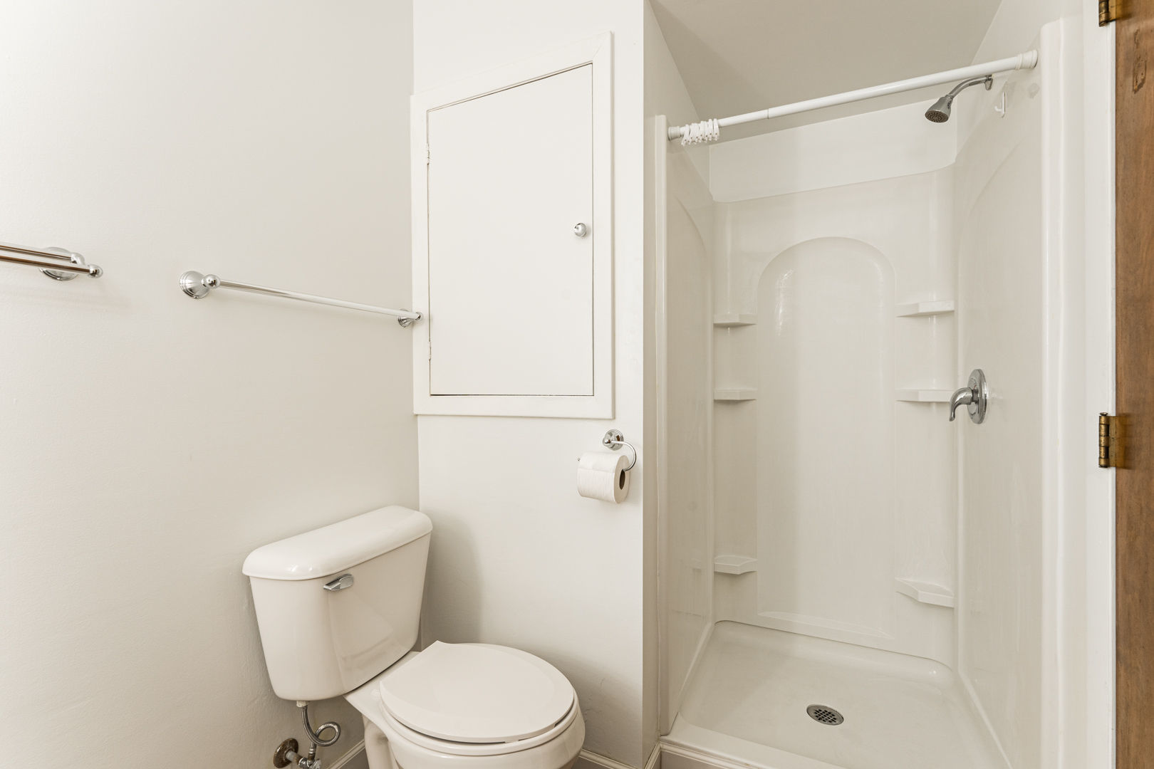 519 Normal Road DeKalb, IL 60115 - Photo 23 of 43 a white toilet sitting next to a shower