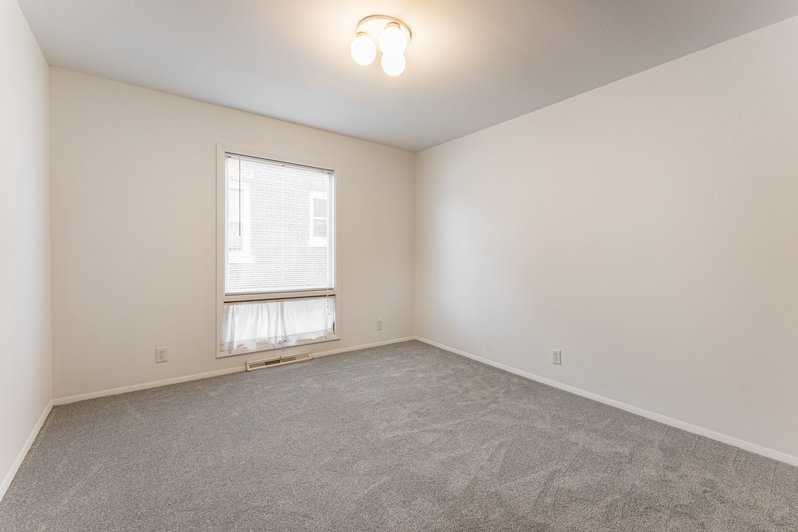 519 Normal Road DeKalb, IL 60115 - Photo 24 of 43 an empty room with a window