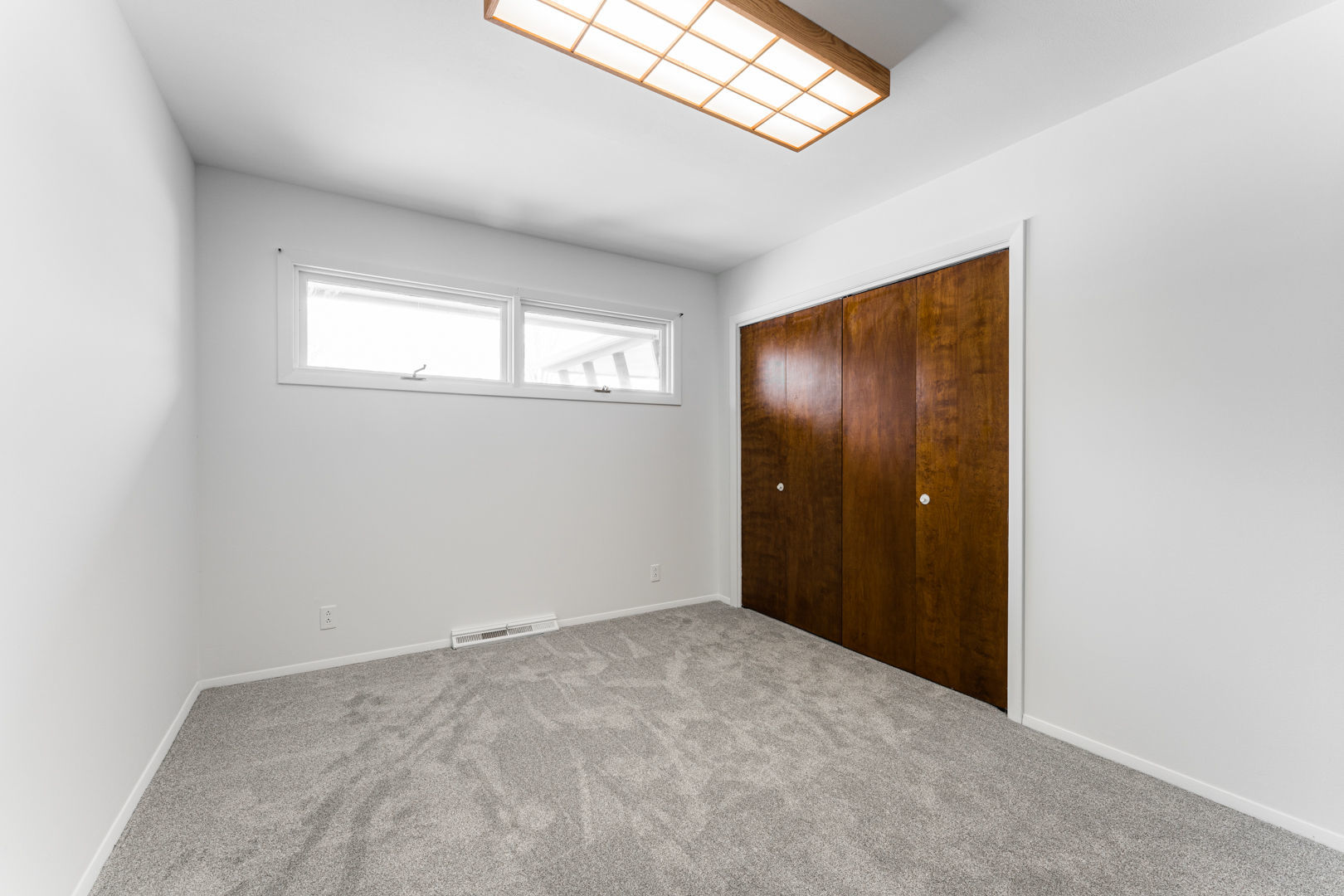 519 Normal Road DeKalb, IL 60115 - Photo 26 of 43 an empty room with windows and closet