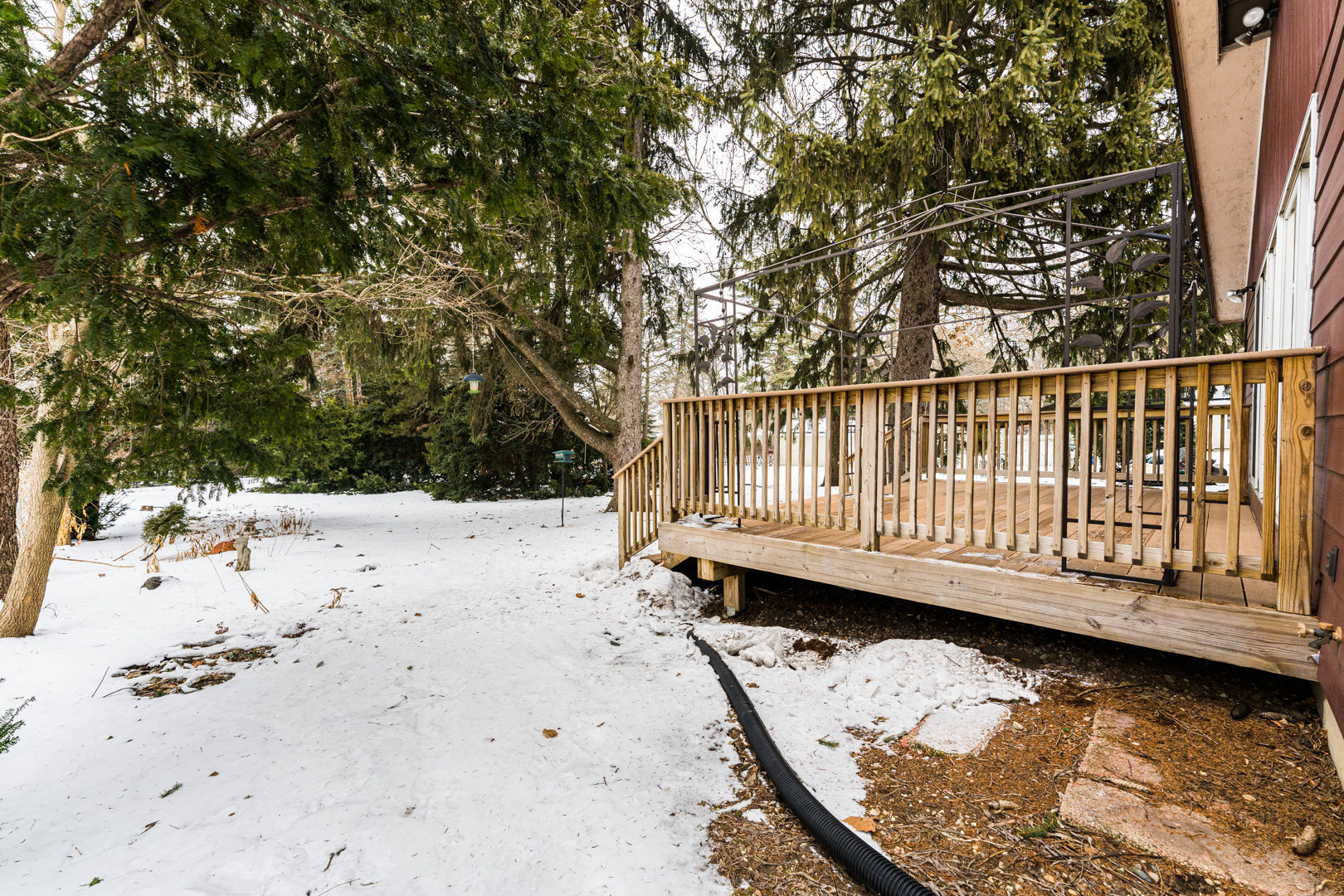 519 Normal Road DeKalb, IL 60115 - Photo 38 of 43 a view of a wooden deck with a large trees