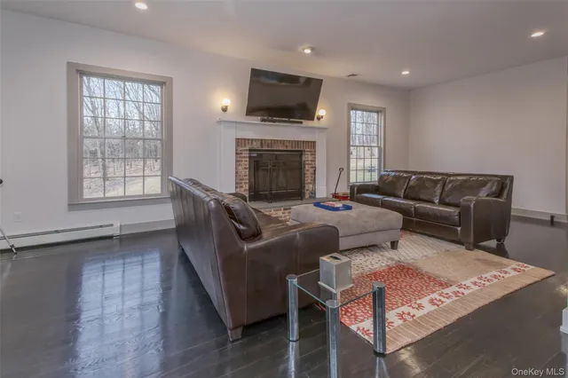 a living room with furniture or flat screen tv and a fireplace