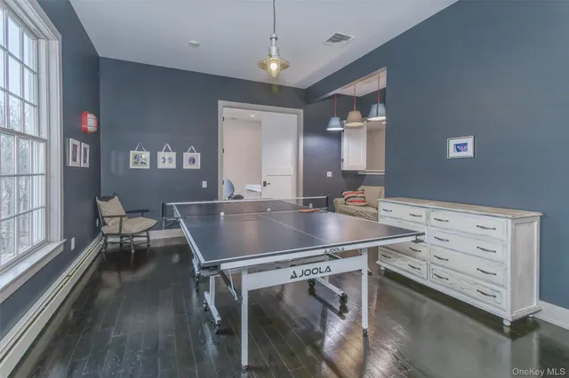 a dining room with table chairs and chandelier