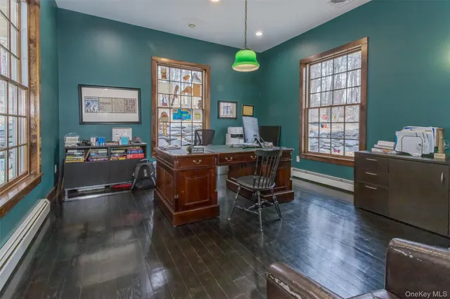 a dining room with furniture and window