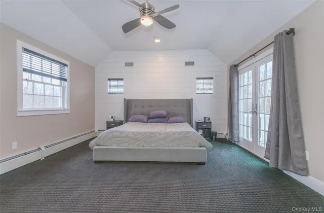 a bedroom with a bed lamp and window