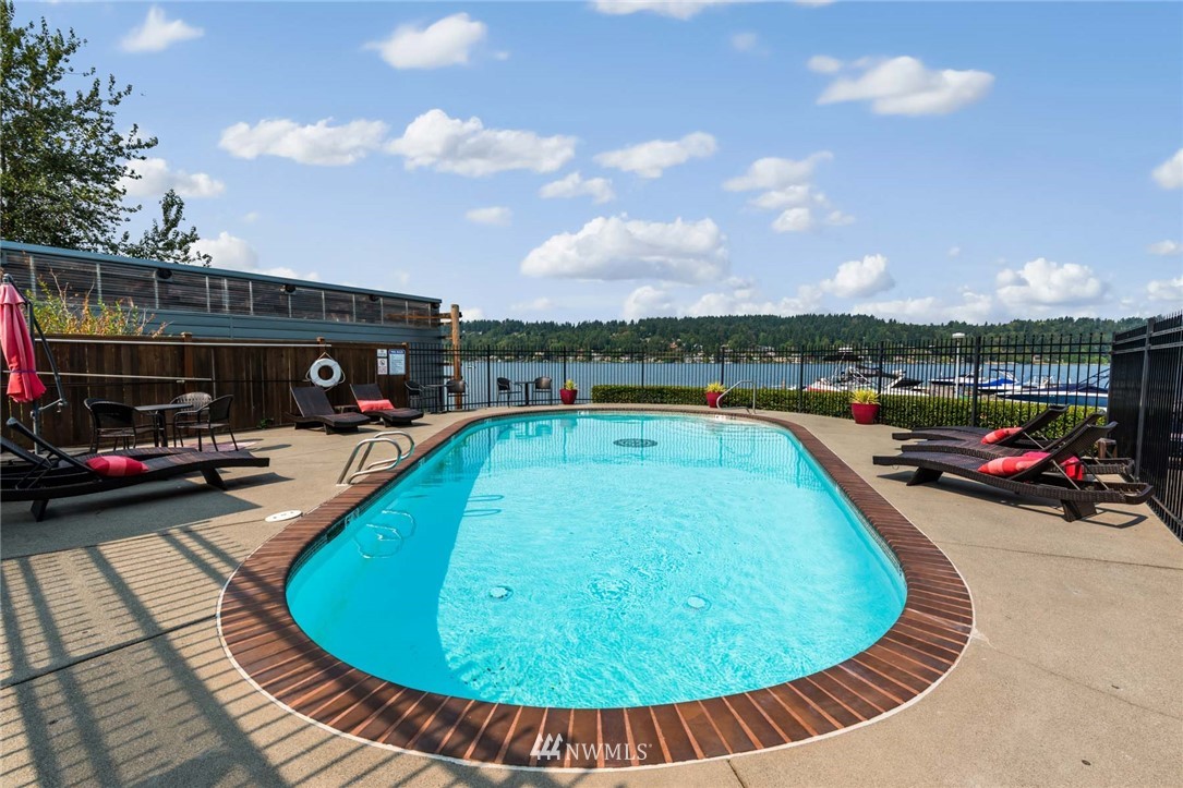 5021 Ripley Lane North, Unit 209 Renton, WA 98056 - Photo 14 of 19 a view of a swimming pool with seating area