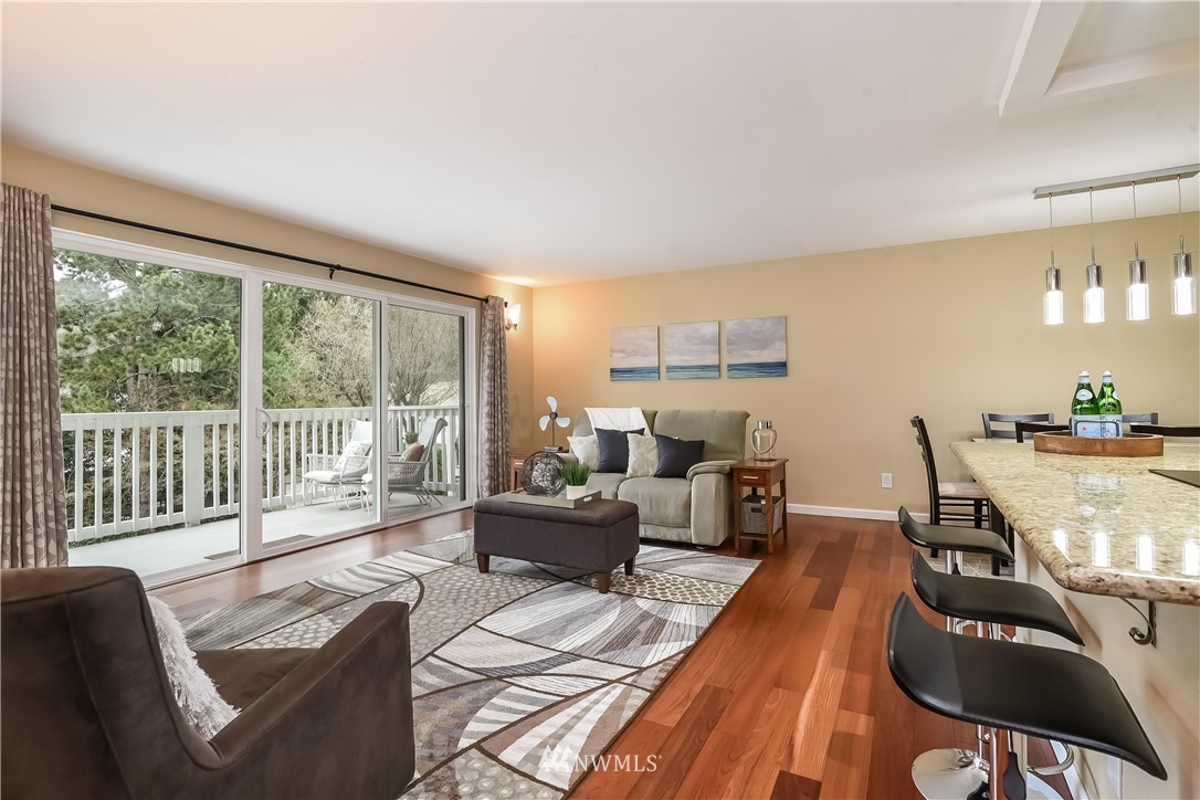 5021 Ripley Lane North, Unit 209 Renton, WA 98056 - Photo 3 of 19 a living room with furniture and a large window