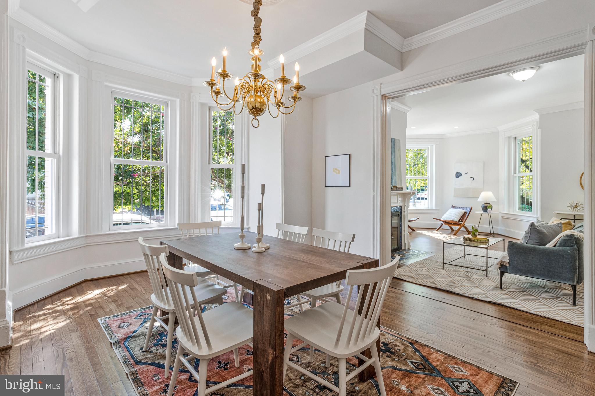 334 E Street Northeast Washington, DC 20002 - Photo 10 of 32 a view of a dining room with furniture a chandelier and wooden floor