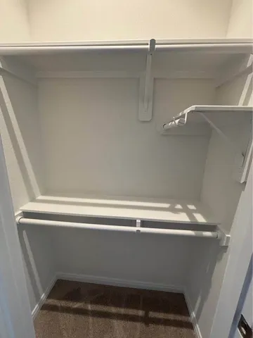 a work room with furniture and a window