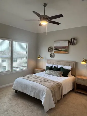 a spacious bathroom with a shower sink double and mirror