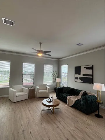 a kitchen with granite countertop a sink and a refrigerator
