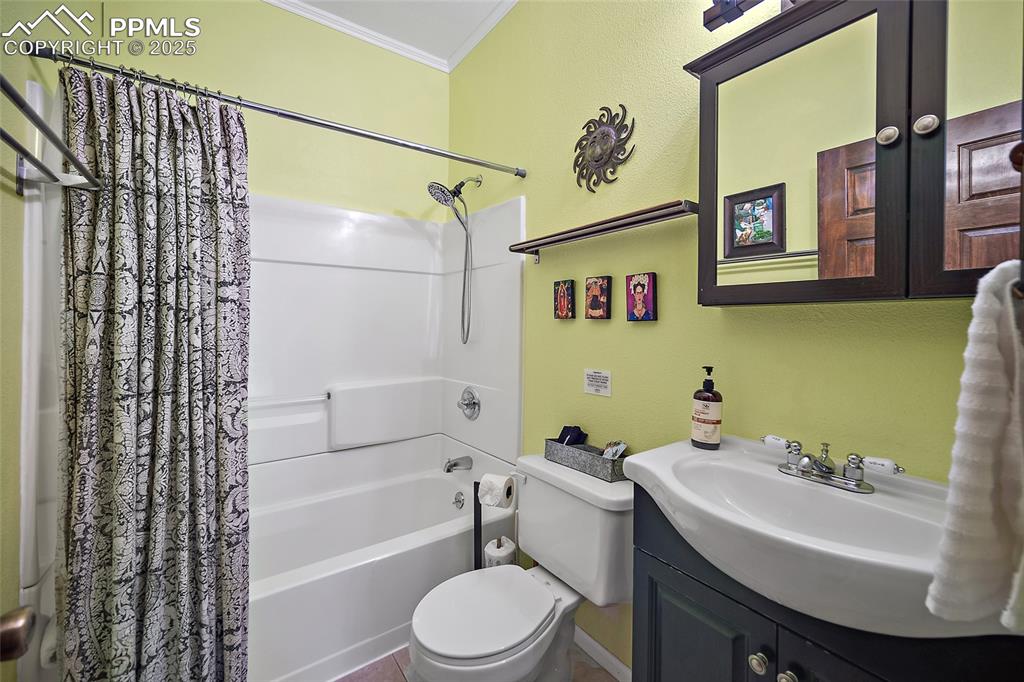 9845 Mesa Road Cascade, CO 80809 - Photo 18 of 50 a bathroom with a sink toilet and shower