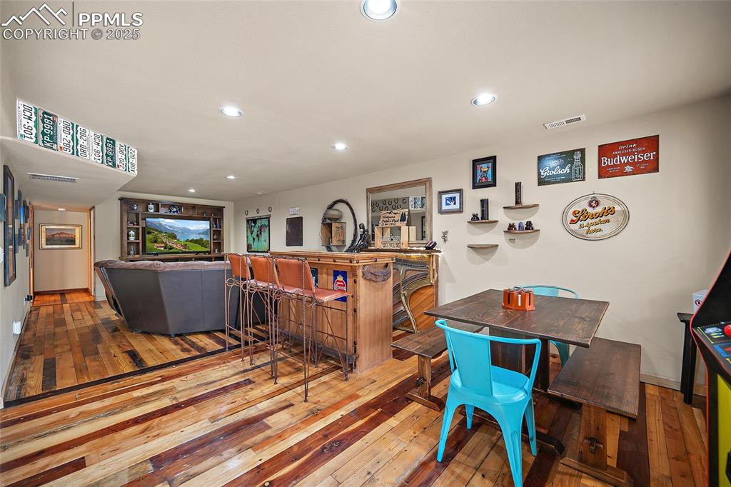 9845 Mesa Road Cascade, CO 80809 - Photo 20 of 50 a living room with furniture and a flat screen tv