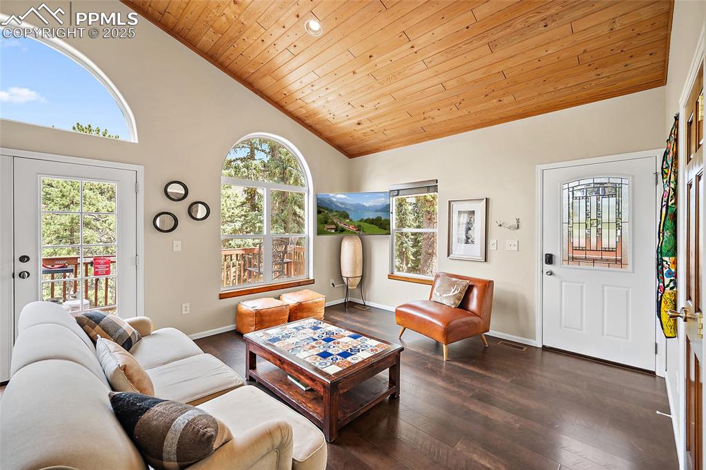 9845 Mesa Road Cascade, CO 80809 - Photo 2 of 50 a living room with furniture and a large window