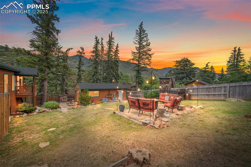 9845 Mesa Road Cascade, CO 80809 - Photo 32 of 50 a view of a chairs and tables in the patio