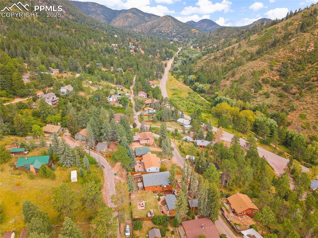 9845 Mesa Road Cascade, CO 80809 - Photo 45 of 50 a view of residential houses with swimming pool and mountain view