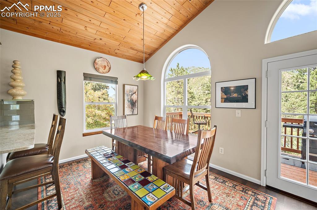 9845 Mesa Road Cascade, CO 80809 - Photo 5 of 50 a view of a dining room with furniture window and wooden floor