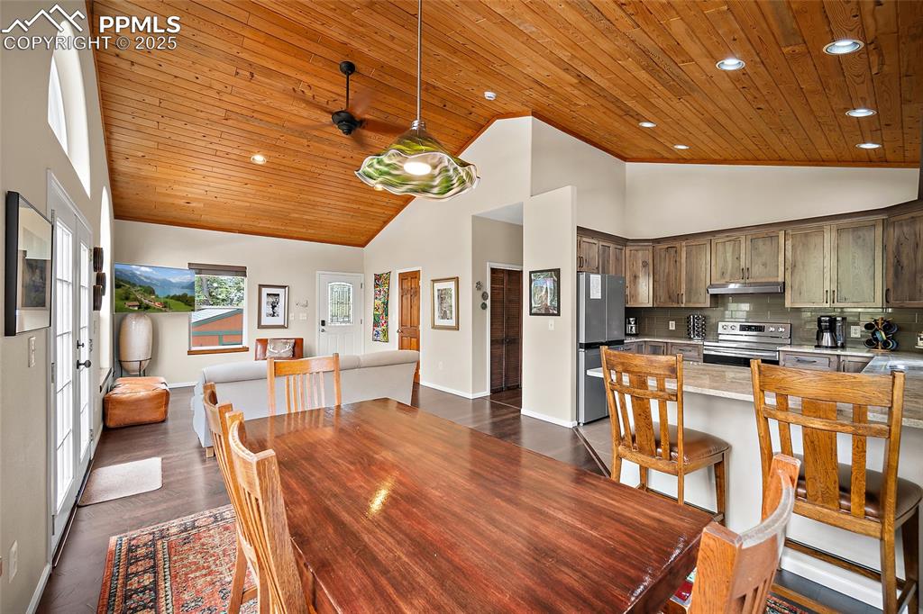 9845 Mesa Road Cascade, CO 80809 - Photo 6 of 50 a large kitchen with a table and chairs