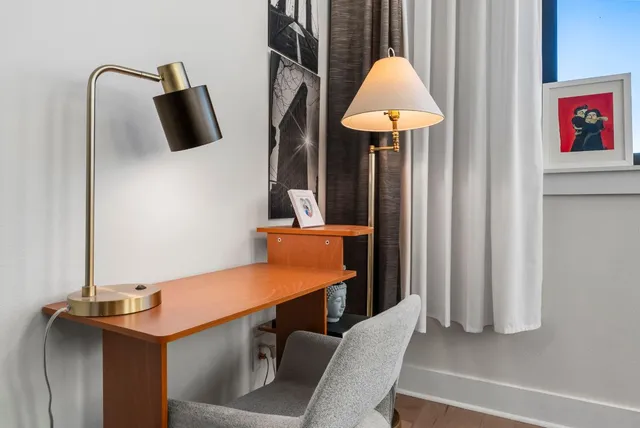 a room with a table and a flat screen tv