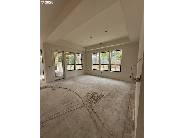 a view of a room with a large window