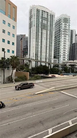 a view of balcony with residential apartment building in front of it