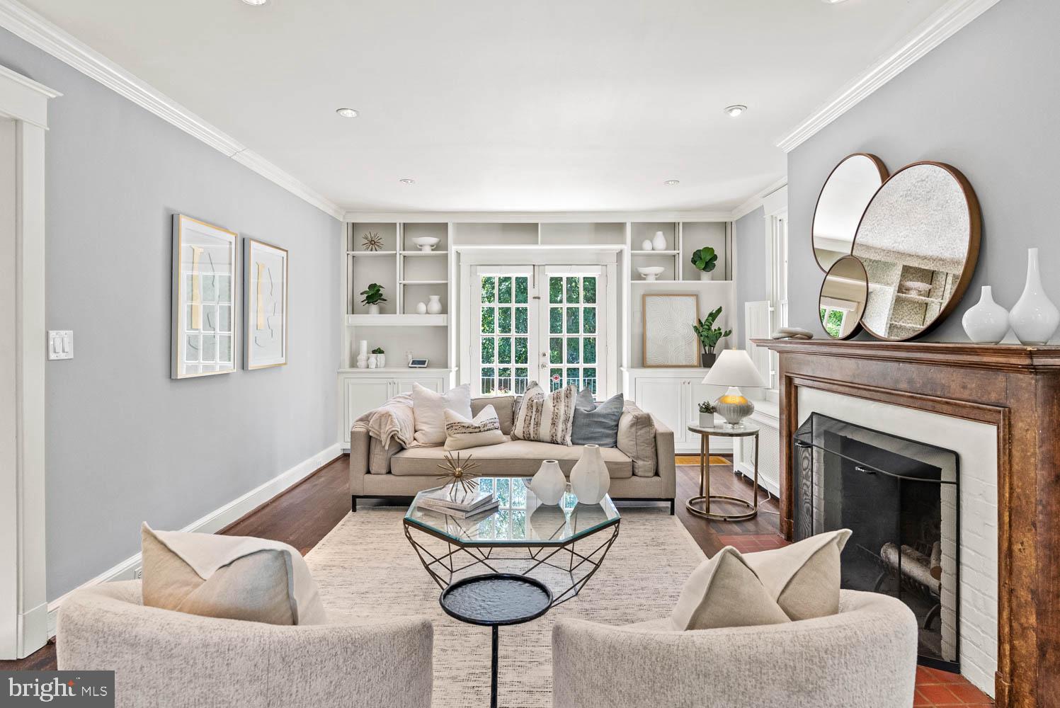 7406 Brookville Road Chevy Chase, MD 20815 - Photo 11 of 72 a living room with furniture and a fireplace