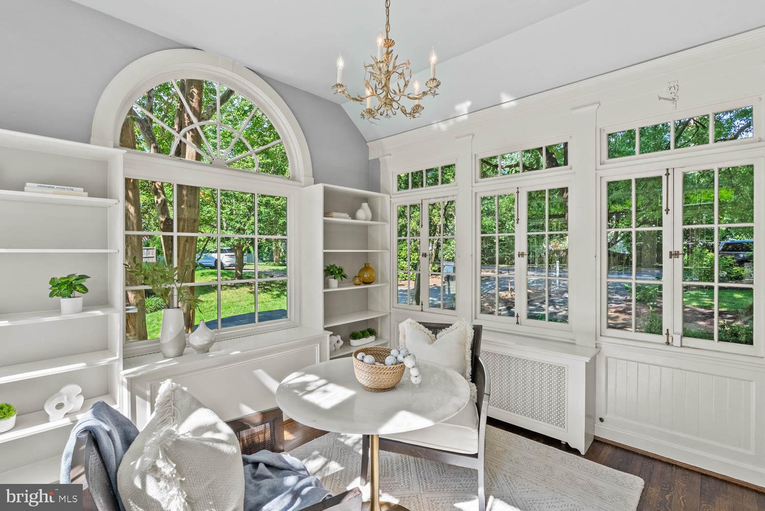 7406 Brookville Road Chevy Chase, MD 20815 - Photo 15 of 72 a living room with furniture and a large window