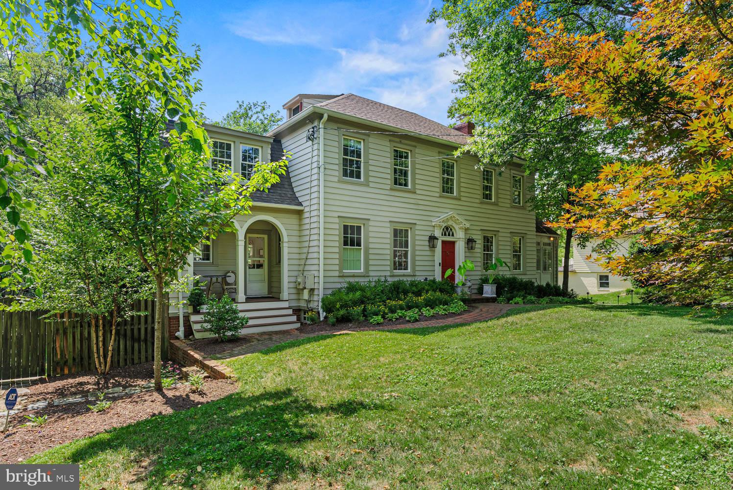 7406 Brookville Road Chevy Chase, MD 20815 - Photo 2 of 72 a front view of a house with a yard