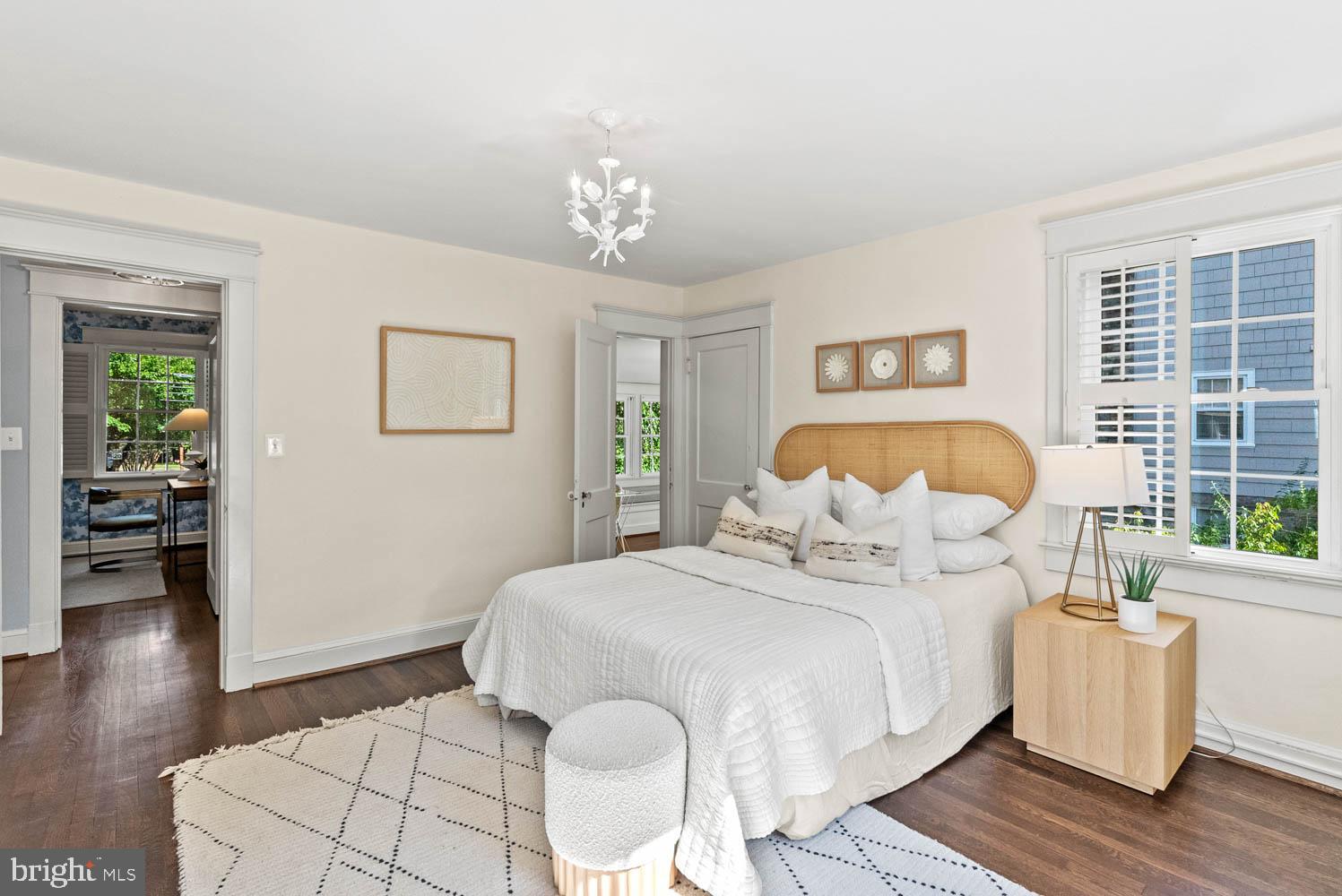7406 Brookville Road Chevy Chase, MD 20815 - Photo 35 of 72 a bedroom with bed and wooden floor
