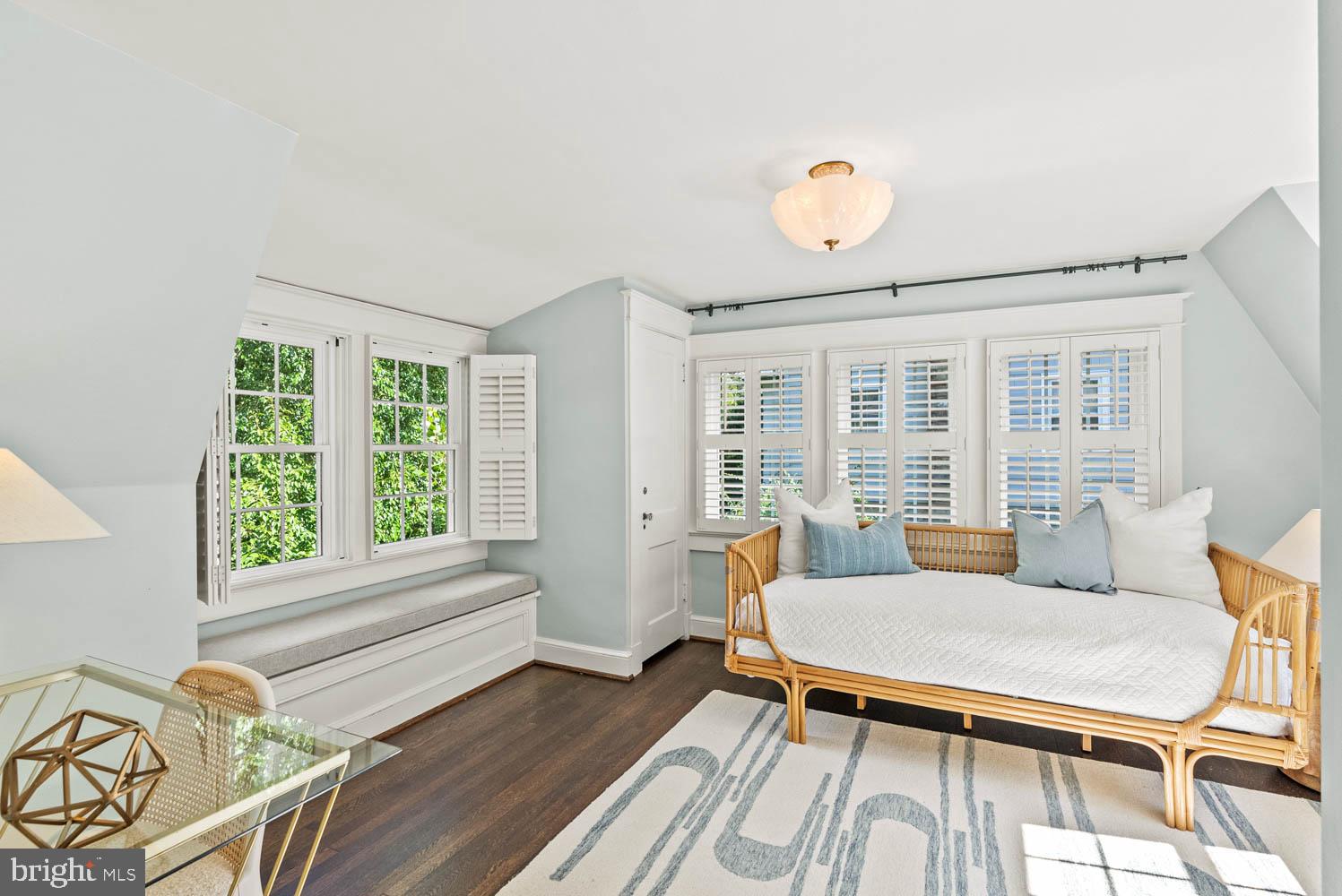 7406 Brookville Road Chevy Chase, MD 20815 - Photo 39 of 72 a living room with furniture a window and a table