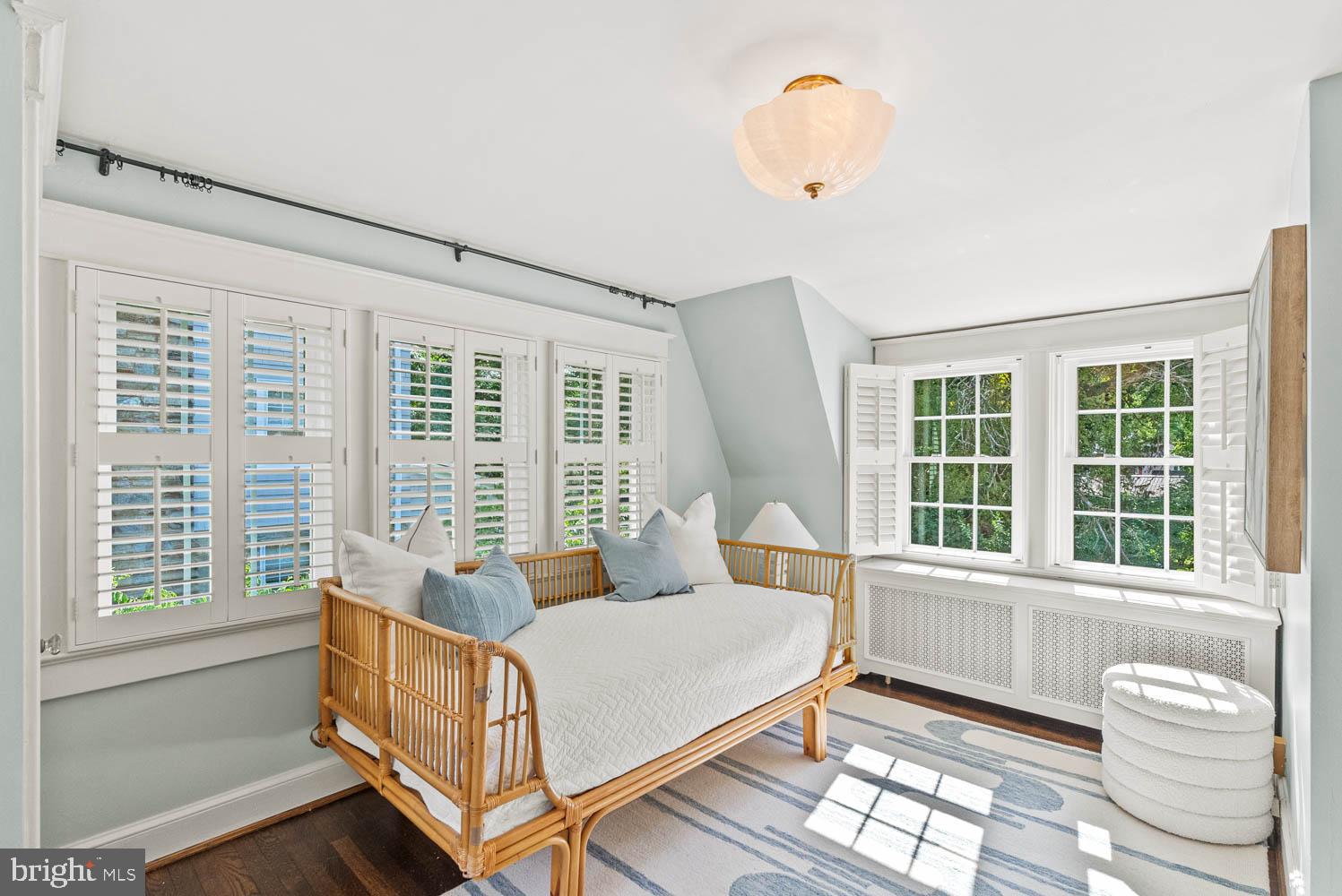 7406 Brookville Road Chevy Chase, MD 20815 - Photo 40 of 72 a spacious bedroom with a bed and a window