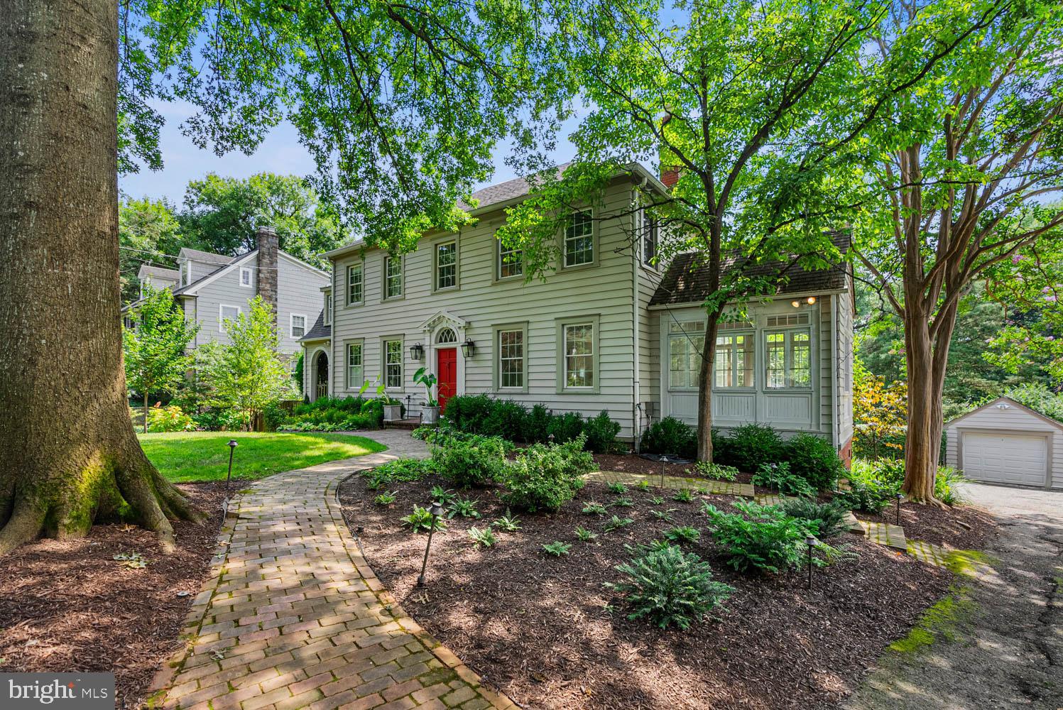7406 Brookville Road Chevy Chase, MD 20815 - Photo 4 of 72 a view of a garden with plants and large trees
