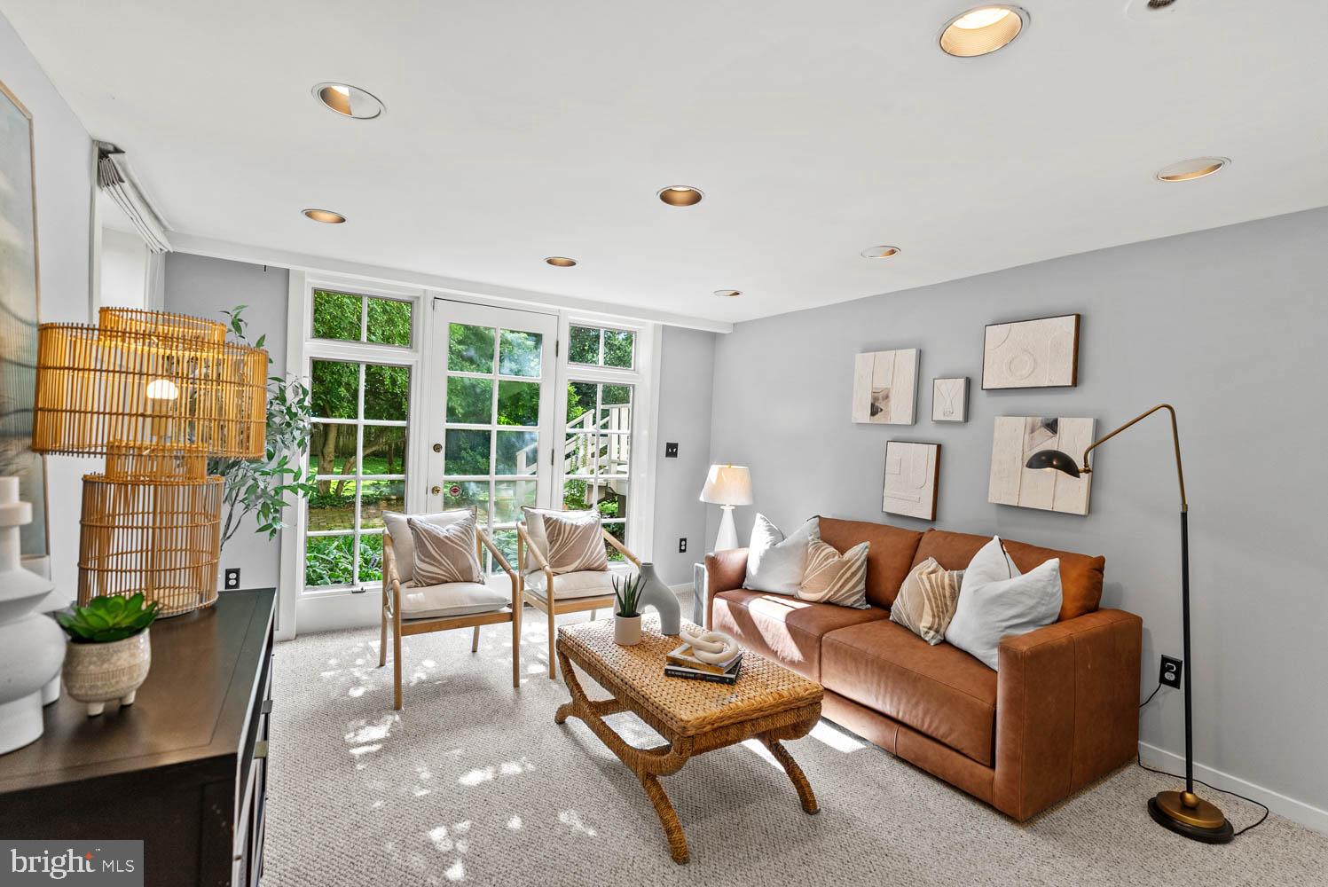 7406 Brookville Road Chevy Chase, MD 20815 - Photo 43 of 72 a living room with furniture and a window