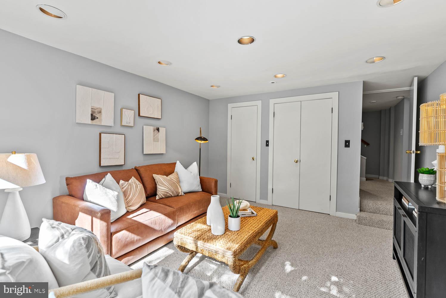 7406 Brookville Road Chevy Chase, MD 20815 - Photo 45 of 72 a living room with furniture and a couch