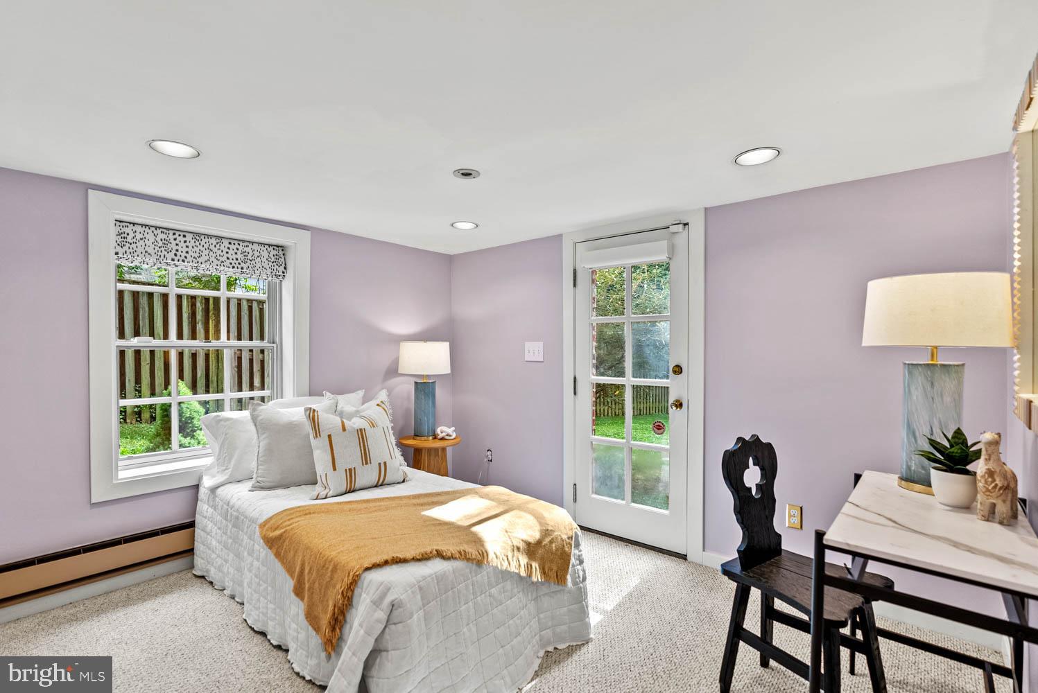 7406 Brookville Road Chevy Chase, MD 20815 - Photo 46 of 72 a bedroom with a bed and a table