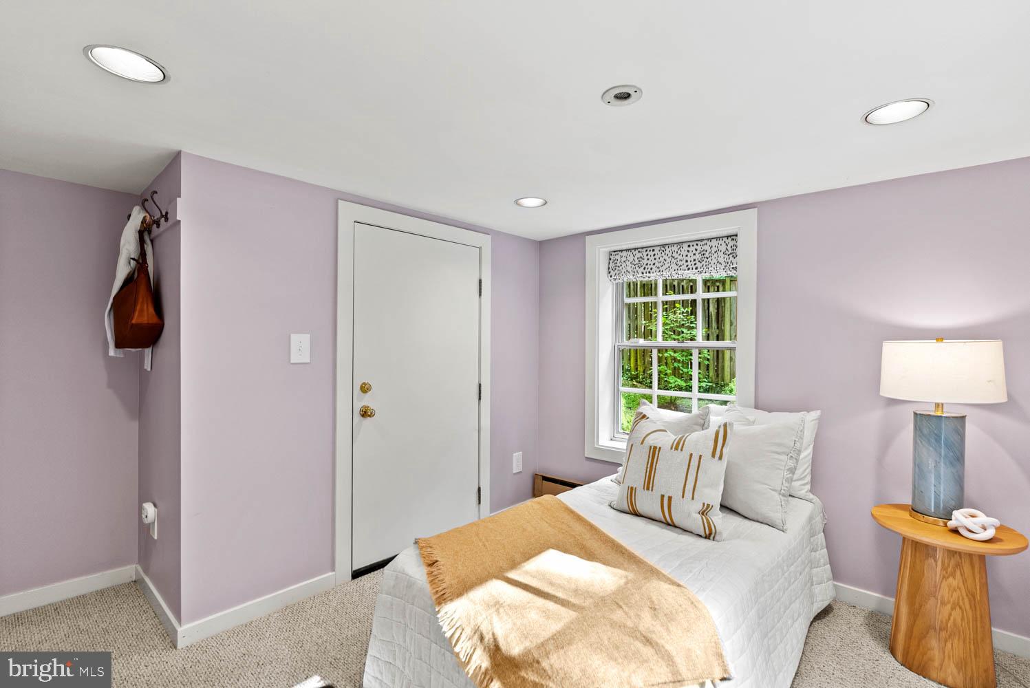 7406 Brookville Road Chevy Chase, MD 20815 - Photo 47 of 72 a bedroom with a bed and a window