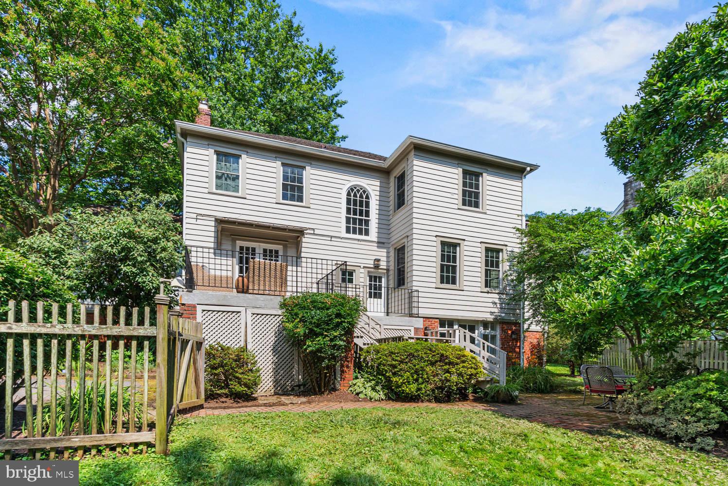 7406 Brookville Road Chevy Chase, MD 20815 - Photo 58 of 72 a front view of a house with a garden